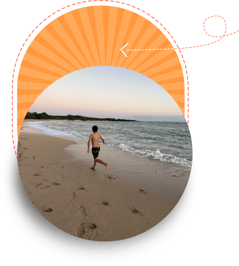 A man in swim shorts walking on a sandy beach, framed by a graphic orange circular design with a dotted line and arrow.